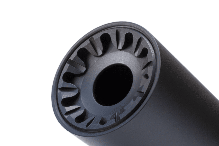 Close-up view of the end of a black cylindrical object, featuring a circular opening with a patterned, grooved design around the edge—reflecting recent NFA item interest surge.