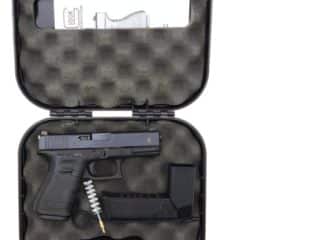 2A Marketplace: Private Firearm Classifieds An open black hard case with foam lining, containing a black handgun, a magazine, a cleaning brush, and an instruction manual. Private sale of guns.